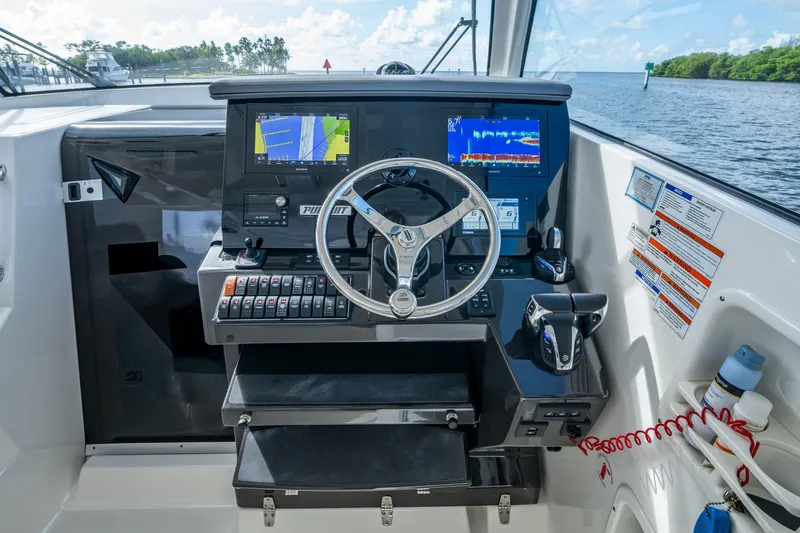  Yacht Photos Pics 2022 Pursuit OS 355 Offshore helm with advanced navigation displays and controls.