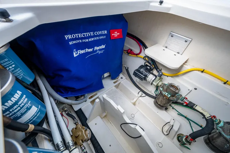  Yacht Photos Pics Engine compartment of 2022 Pursuit OS 355 Offshore with Fischer Panda cover and Yamaha filters.