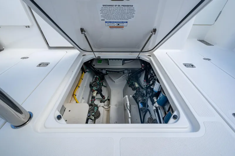  Yacht Photos Pics 2022 Pursuit OS 355 Offshore engine compartment, showcasing clean and organized mechanical components.