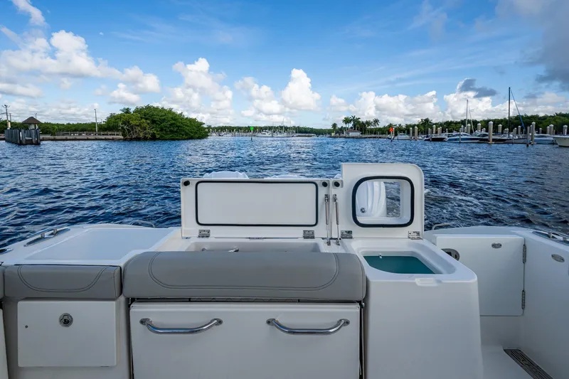  Yacht Photos Pics 2022 Pursuit OS 355 Offshore boat interior with scenic marina view.