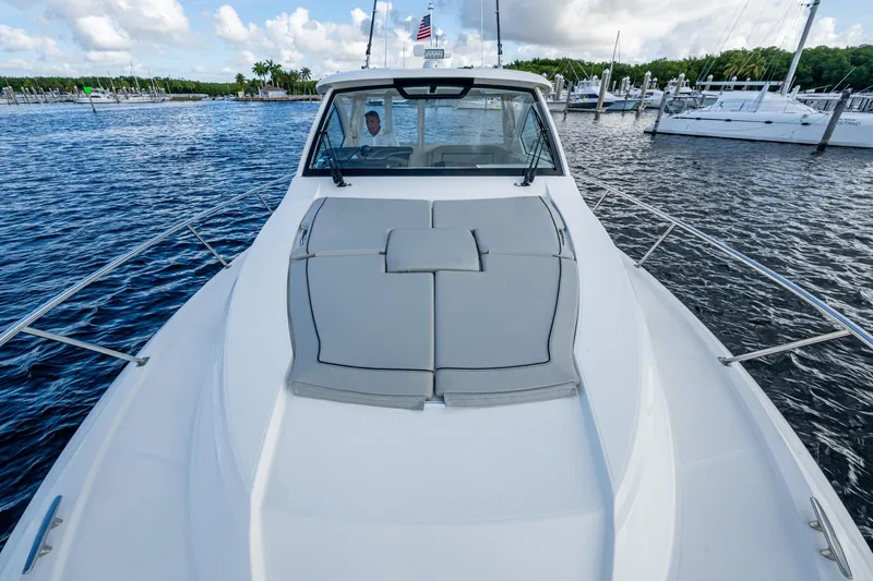  Yacht Photos Pics 2022 Pursuit OS 355 Offshore boat on water, featuring spacious deck and sleek design.