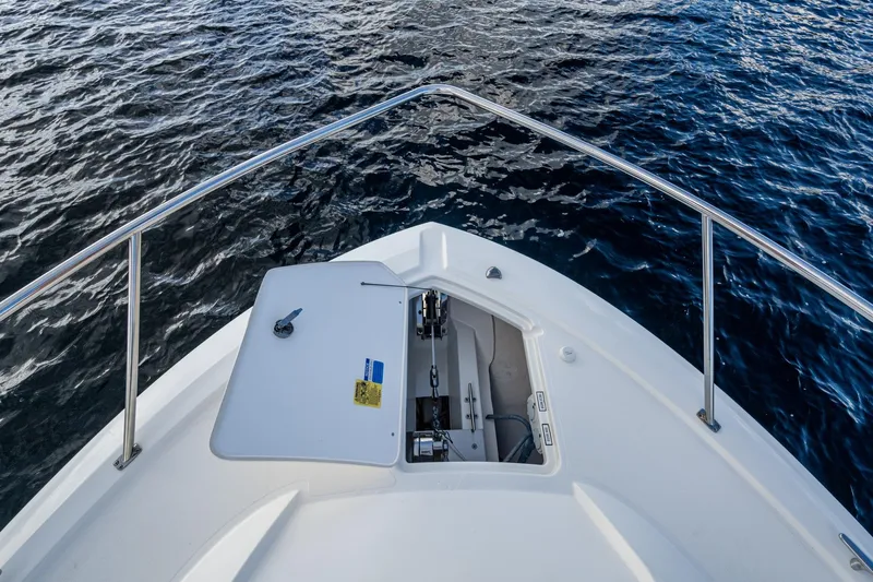  Yacht Photos Pics Bow view of 2022 Pursuit OS 355 Offshore boat on water.