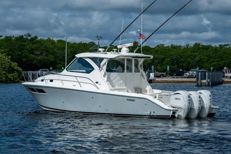  Yacht Photos Pics 2022 Pursuit OS 355 Offshore boat with triple Yamaha engines on water.