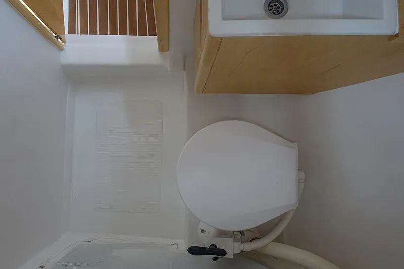 Z28 Yacht Photos Pics Compact bathroom in 2025 Zonda Yachts Z28, featuring a toilet and sink.