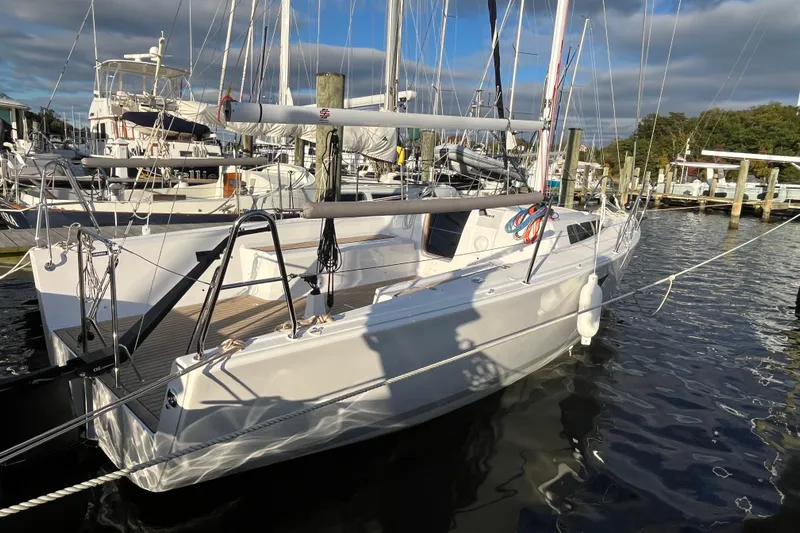 Z28 Yacht Photos Pics 2025 Zonda Yachts Z28 docked at marina, sleek design, sunny day, calm waters.