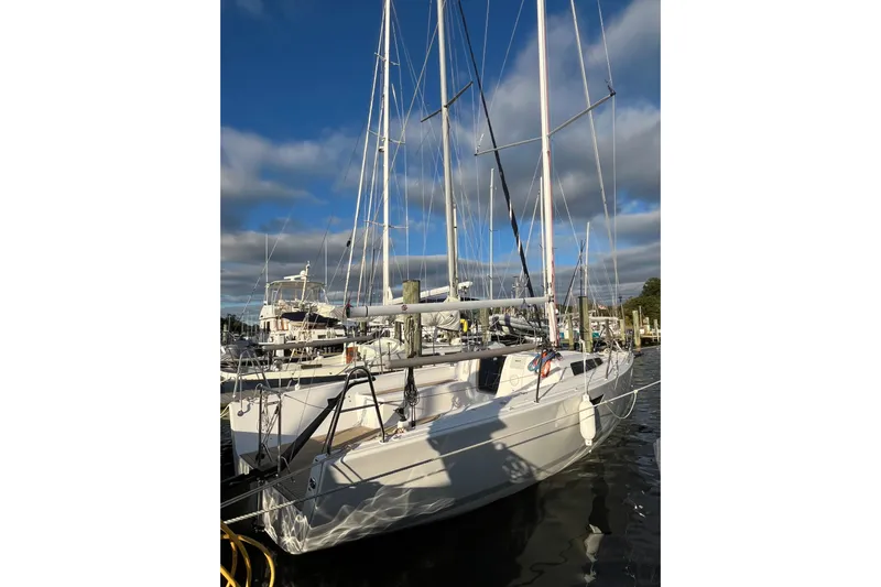 Z28 Yacht Photos Pics 2025 Zonda Yachts Z28 sailboat docked under a blue sky.