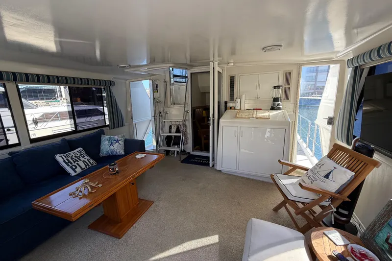 La Vie Dansante Yacht Photos Pics Interior of 1991 Californian 55 Cockpit Motor Yacht with cozy seating and nautical decor.