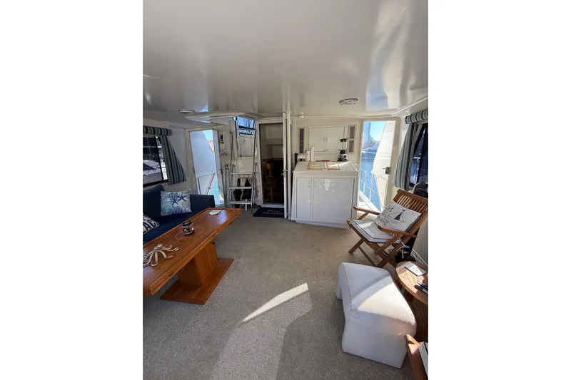 La Vie Dansante Yacht Photos Pics Luxurious interior of 1991 Californian 55 Cockpit Motor Yacht with elegant seating and decor.