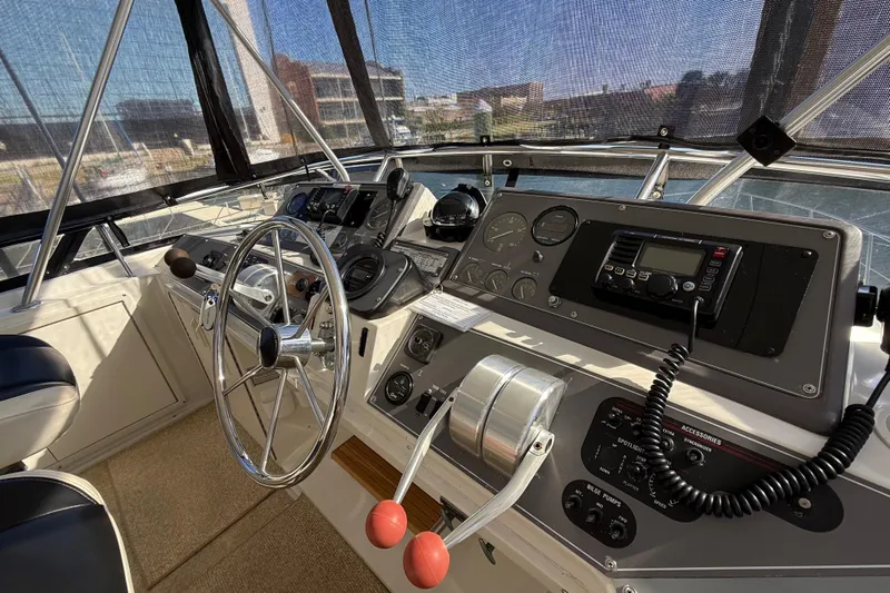 La Vie Dansante Yacht Photos Pics Cockpit of 1991 Californian 55 Cockpit Motor Yacht with steering wheel and control panel.