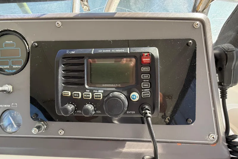 La Vie Dansante Yacht Photos Pics 1991 Californian 55 Cockpit Motor Yacht dashboard with marine radio and gauges.