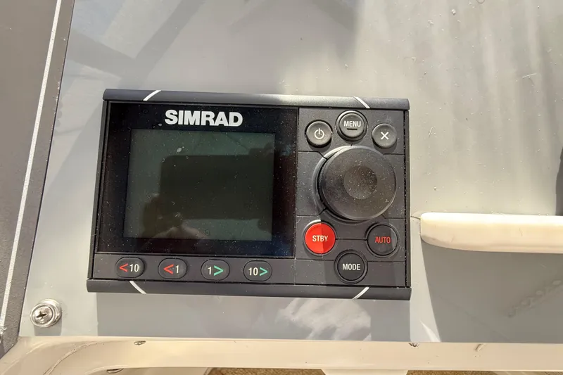 La Vie Dansante Yacht Photos Pics Simrad control panel on 1991 Californian 55 Cockpit Motor Yacht dashboard.