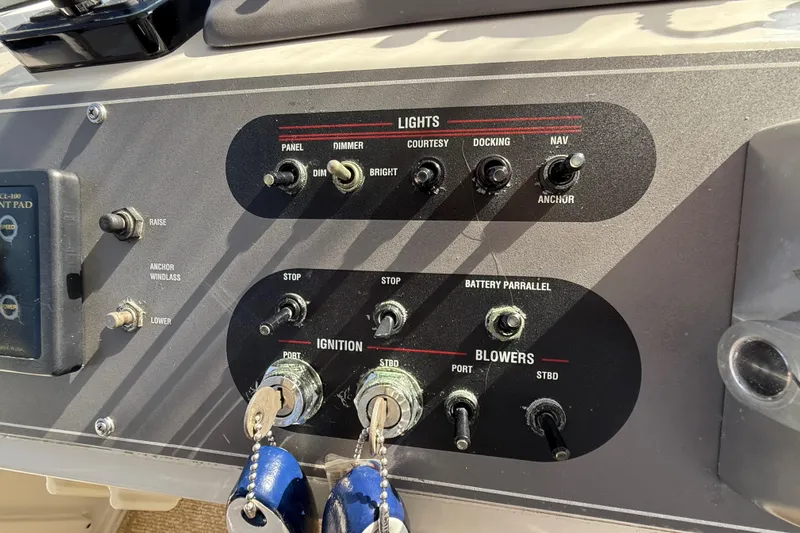 La Vie Dansante Yacht Photos Pics Control panel of 1991 Californian 55 Cockpit Motor Yacht with switches and keys.