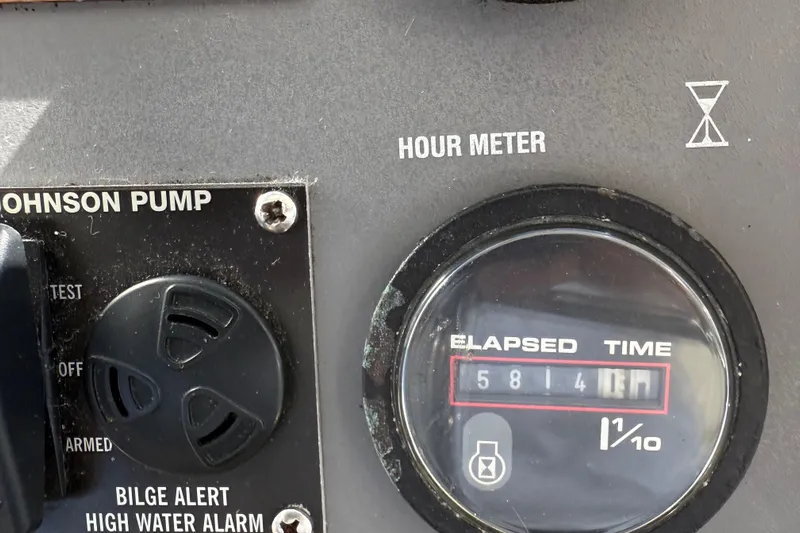 La Vie Dansante Yacht Photos Pics Hour meter and Johnson pump controls on 1991 Californian 55 Cockpit Motor Yacht.