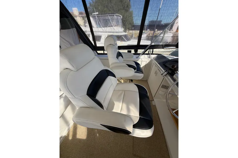 La Vie Dansante Yacht Photos Pics Luxurious cockpit seating on 1991 Californian 55 Cockpit Motor Yacht.