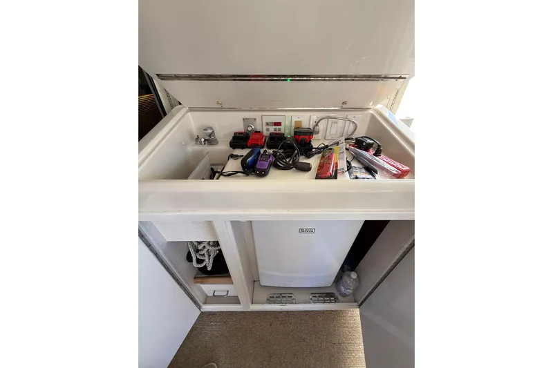 La Vie Dansante Yacht Photos Pics 1991 Californian 55 Cockpit Motor Yacht interior storage with electronics and accessories.