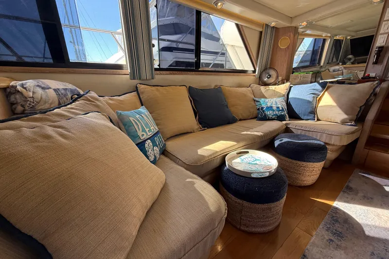 La Vie Dansante Yacht Photos Pics Interior of 1991 Californian 55 Cockpit Motor Yacht with cozy seating and nautical decor.