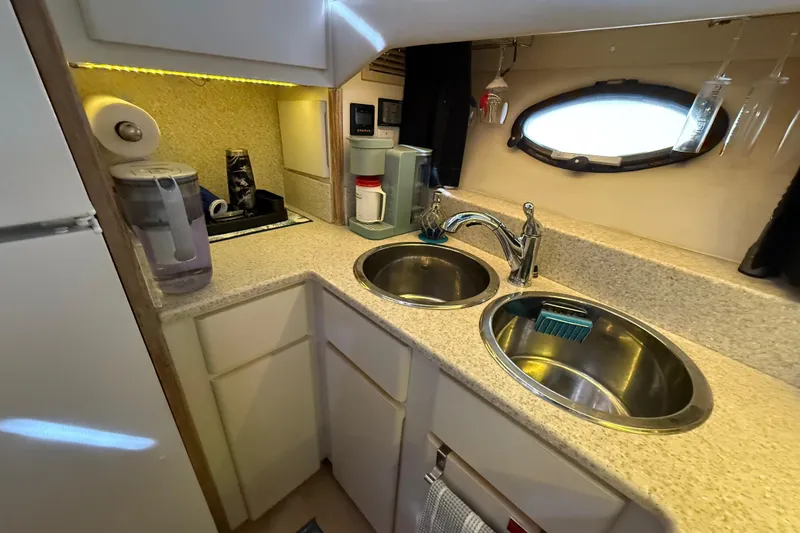 La Vie Dansante Yacht Photos Pics 1991 Californian 55 Cockpit Motor Yacht kitchen with dual sinks and modern appliances.