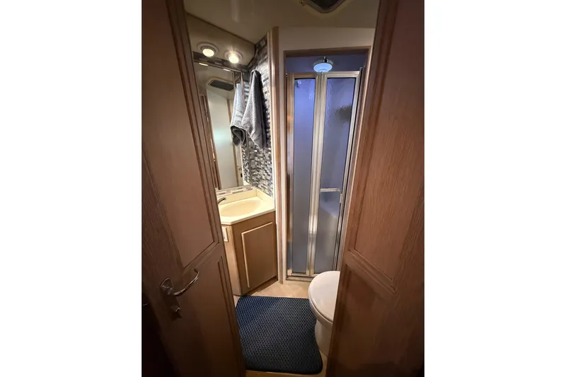 La Vie Dansante Yacht Photos Pics Bathroom interior of 1991 Californian 55 Cockpit Motor Yacht with shower and vanity.