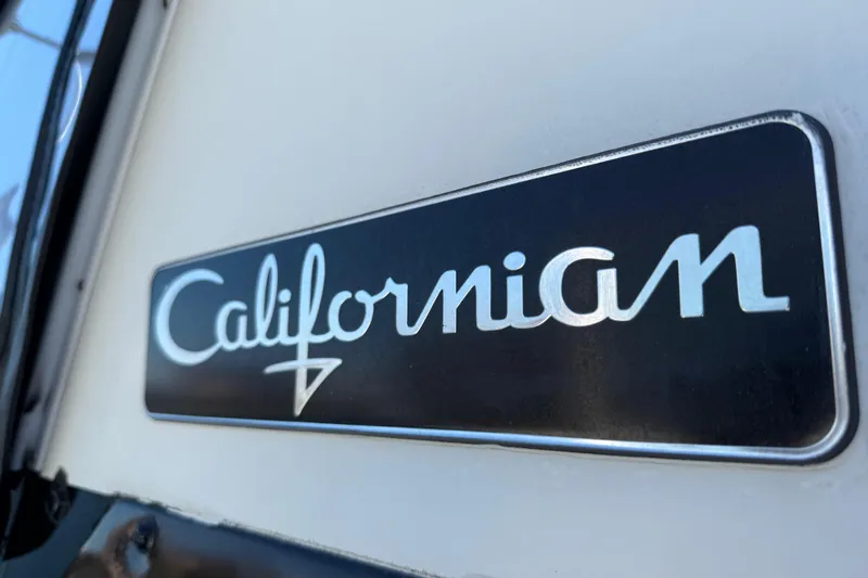 La Vie Dansante Yacht Photos Pics Californian 55 Cockpit Motor Yacht 1991 logo on yacht exterior.