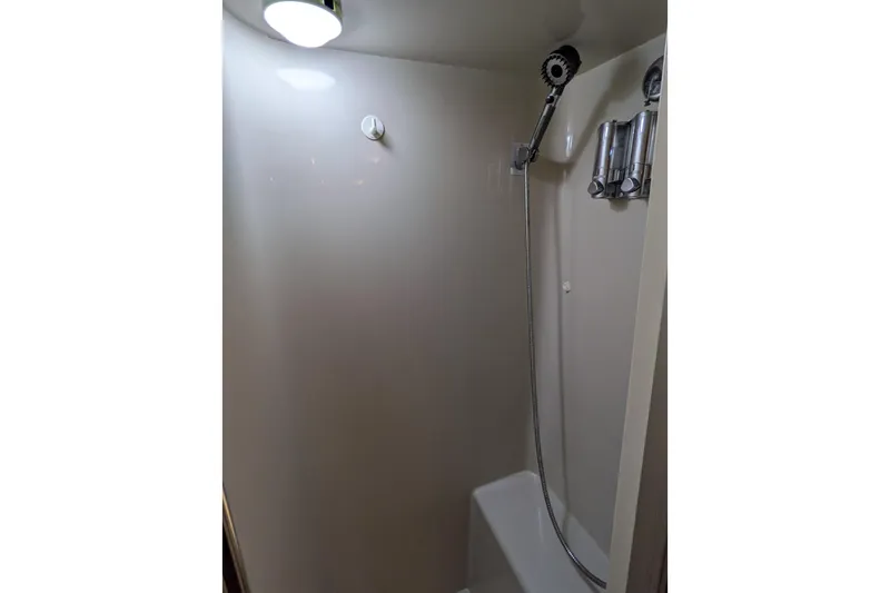 La Vie Dansante Yacht Photos Pics Shower area in 1991 Californian 55 Cockpit Motor Yacht, featuring modern fixtures.