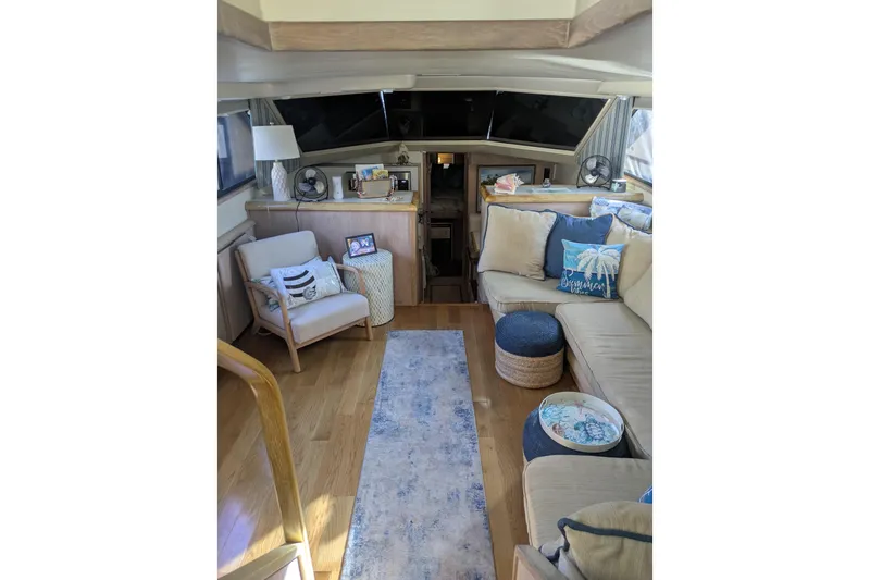 La Vie Dansante Yacht Photos Pics Luxurious interior of a 1991 Californian 55 Cockpit Motor Yacht with cozy seating and decor.