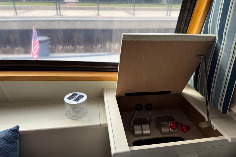 La Vie Dansante Yacht Photos Pics Interior view of 1991 Californian 55 Cockpit Motor Yacht with control levers and window.