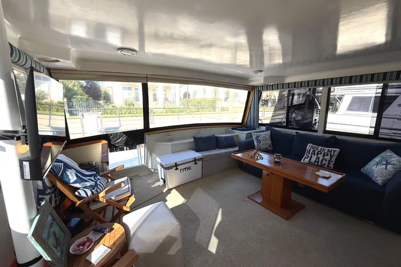 La Vie Dansante Yacht Photos Pics Interior of 1991 Californian 55 Cockpit Motor Yacht with cozy seating and decor.