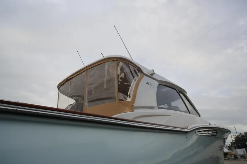 Mango Tango Yacht Photos Pics 2014 San Juan 41 boat with enclosed cockpit under cloudy sky.