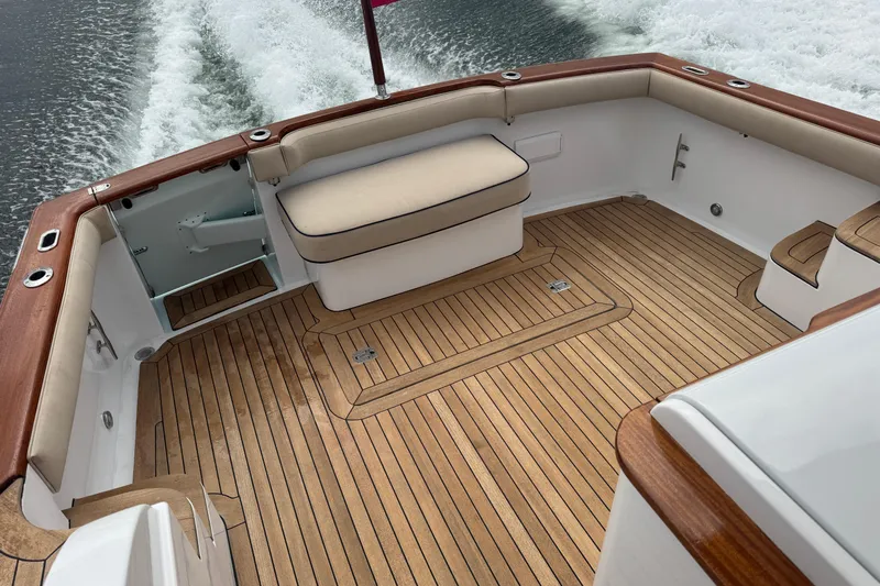 Mango Tango Yacht Photos Pics Luxurious 2014 San Juan 41 boat deck with teak flooring and cushioned seating.
