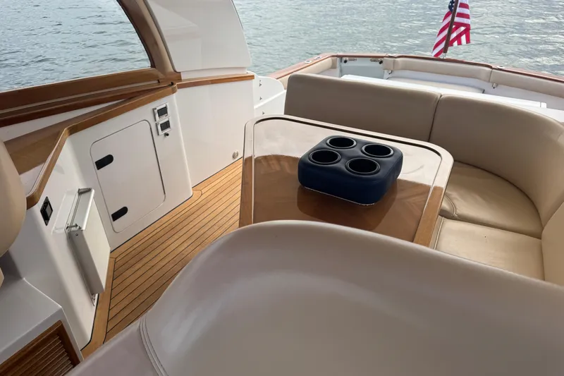 Mango Tango Yacht Photos Pics Luxurious 2014 San Juan 41 yacht interior with elegant seating and table, overlooking water.