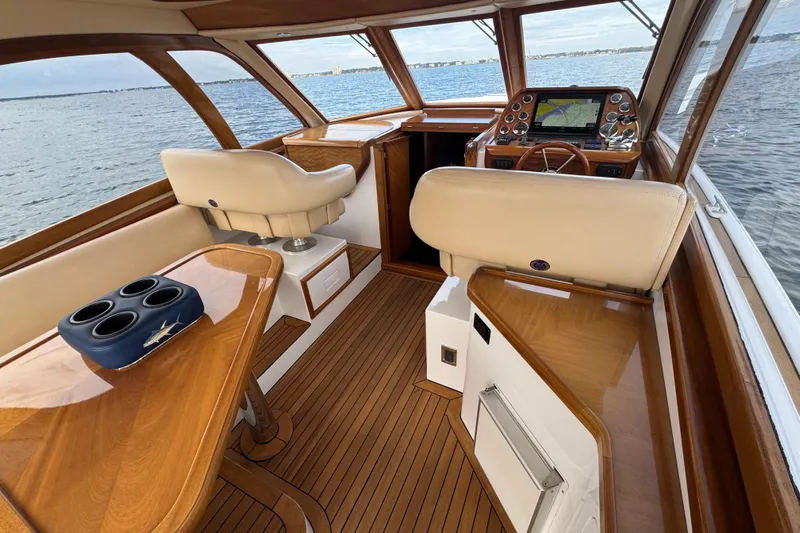 Mango Tango Yacht Photos Pics Luxurious 2014 San Juan 41 yacht interior with polished wood and leather seating.