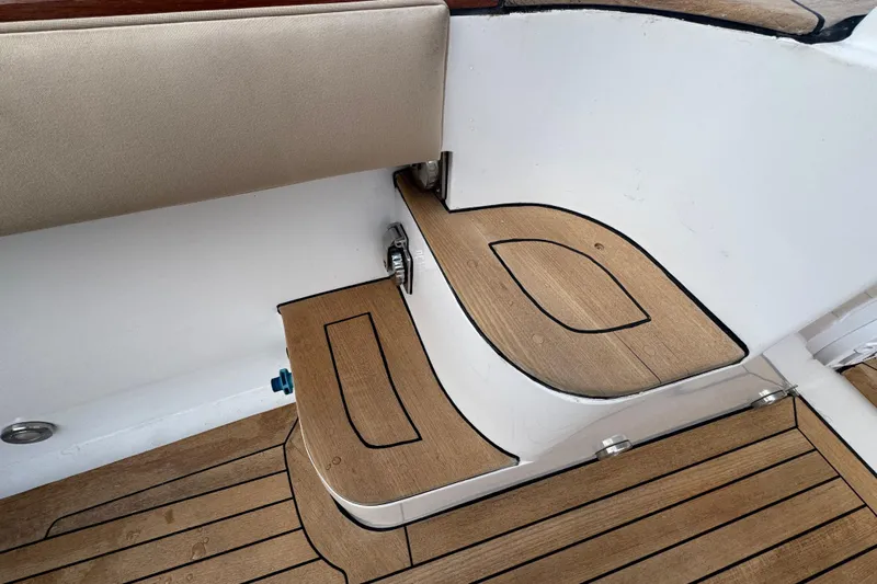 Mango Tango Yacht Photos Pics Teak deck steps on 2014 San Juan 41 yacht, featuring elegant wood finish.