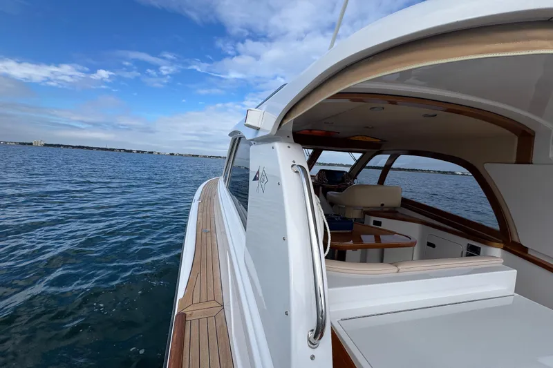 Mango Tango Yacht Photos Pics 2014 San Juan 41 yacht cruising on open water under a clear blue sky.