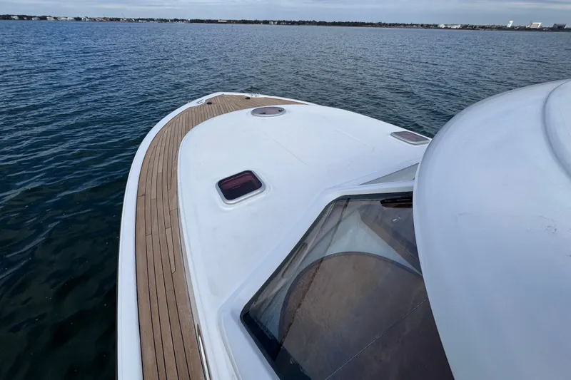 Mango Tango Yacht Photos Pics 2014 San Juan 41 yacht on calm water, featuring sleek deck design.