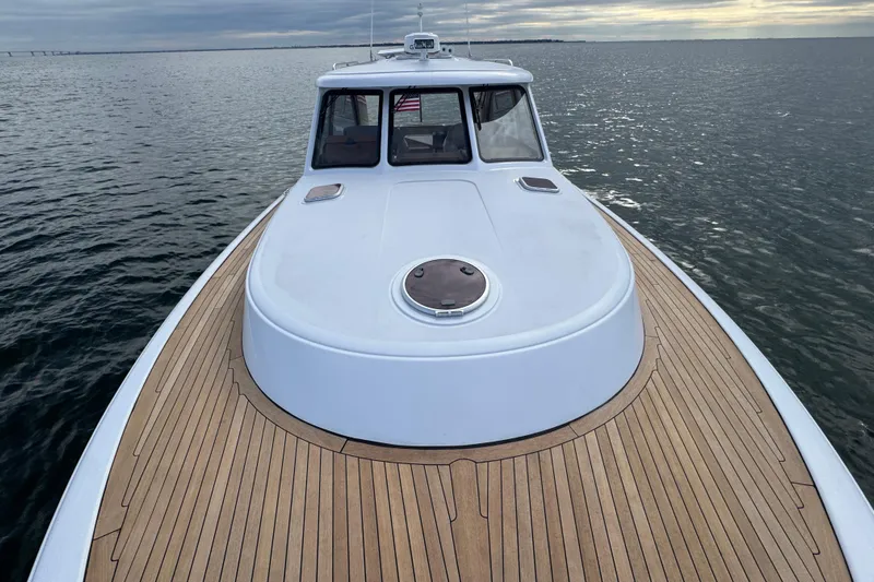 Mango Tango Yacht Photos Pics San Juan 41 yacht, 2014 model, with teak deck cruising on calm waters.