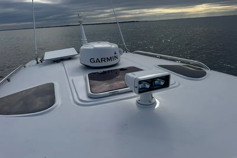 Mango Tango Yacht Photos Pics San Juan 41 boat with Garmin equipment on calm water, cloudy sky, 2014 model.