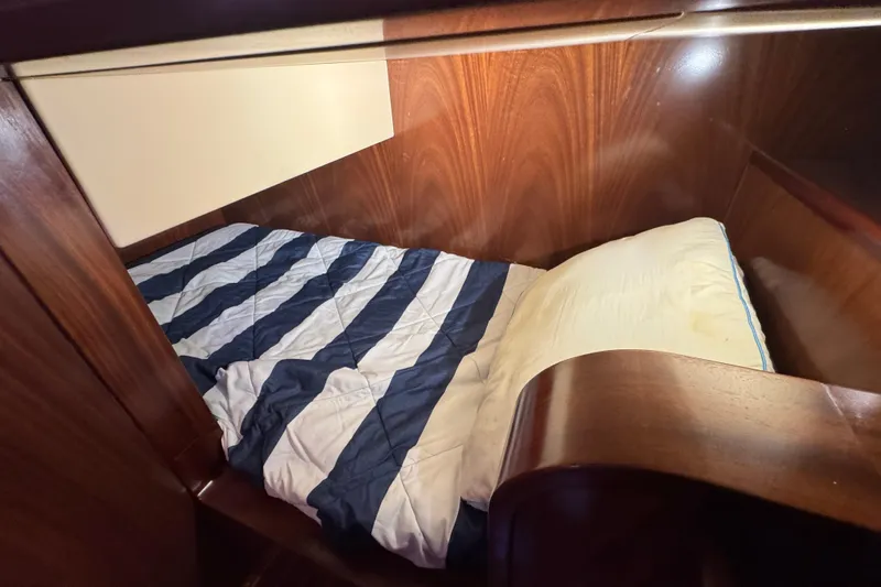 Mango Tango Yacht Photos Pics Cozy cabin bed with striped bedding in 2014 San Juan 41 yacht.