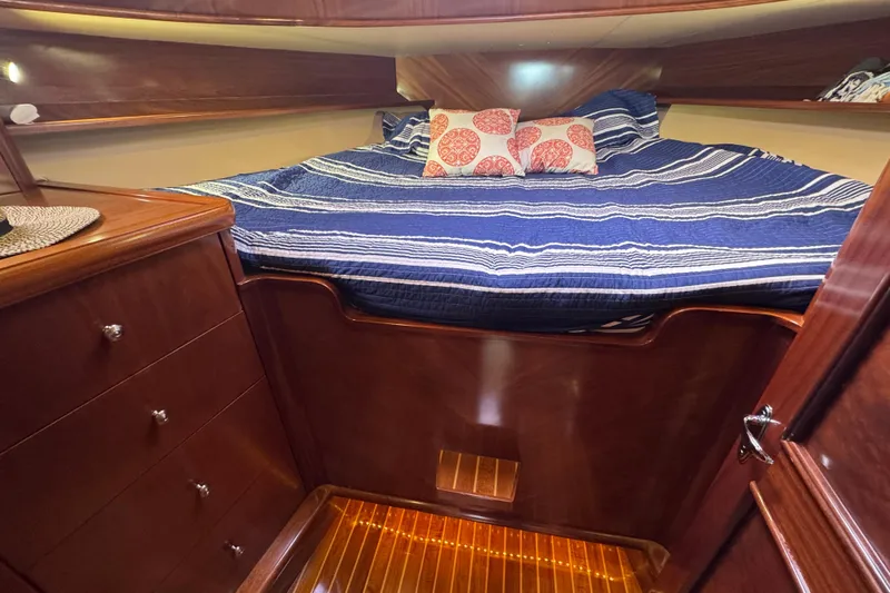 Mango Tango Yacht Photos Pics Luxurious cabin interior of 2014 San Juan 41 yacht with cozy bedding and wooden finish.