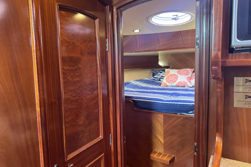 Mango Tango Yacht Photos Pics Luxurious wooden interior of 2014 San Juan 41 yacht cabin with cozy bed.