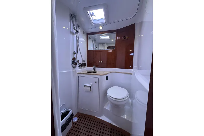 Mango Tango Yacht Photos Pics Luxurious bathroom in 2014 San Juan 41 yacht with modern fixtures and wooden accents.