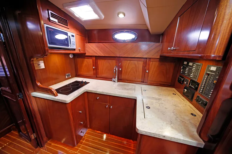 Mango Tango Yacht Photos Pics Luxurious wooden interior of 2014 San Juan 41 yacht kitchen with modern amenities.