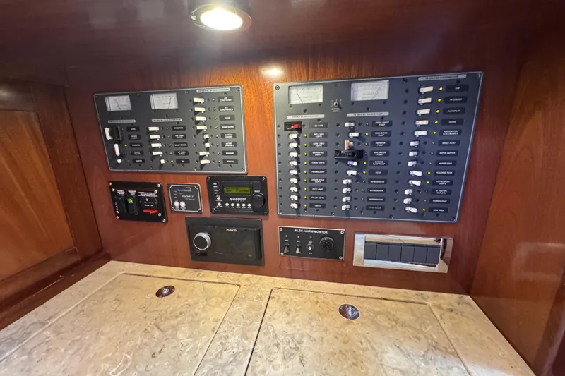 Mango Tango Yacht Photos Pics Electrical control panel on a 2014 San Juan 41 yacht, featuring switches and meters.