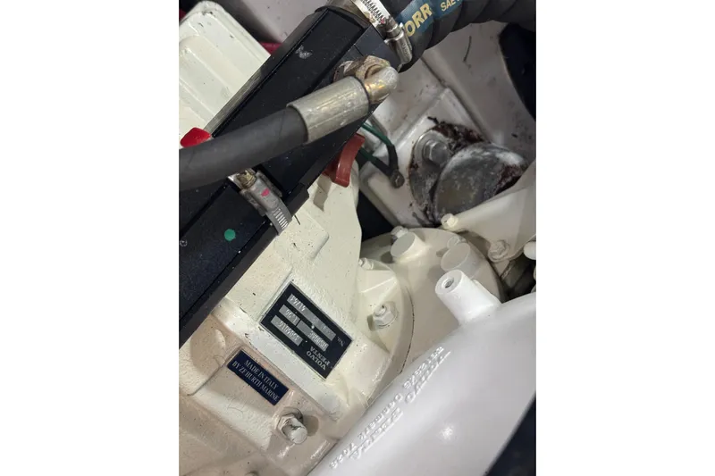 Mango Tango Yacht Photos Pics Close-up of a 2014 San Juan 41 engine component with visible labels and hoses.