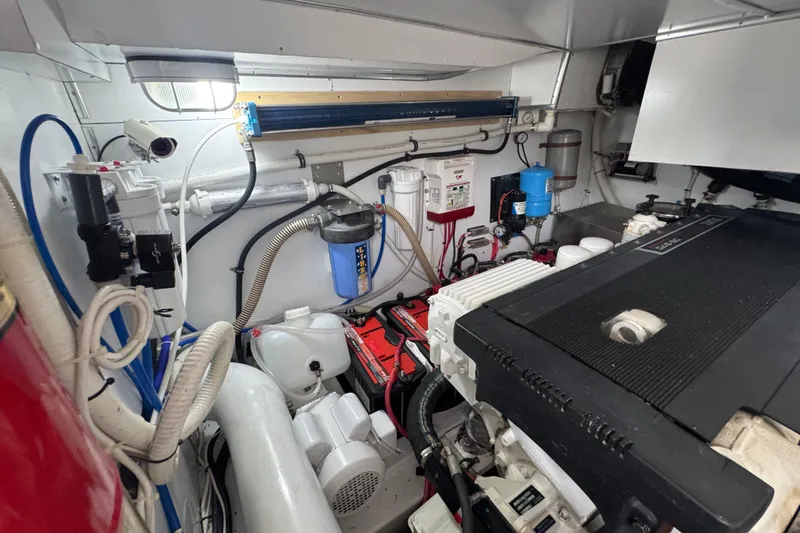 Mango Tango Yacht Photos Pics Engine room of a 2014 San Juan 41 boat, featuring various mechanical components.