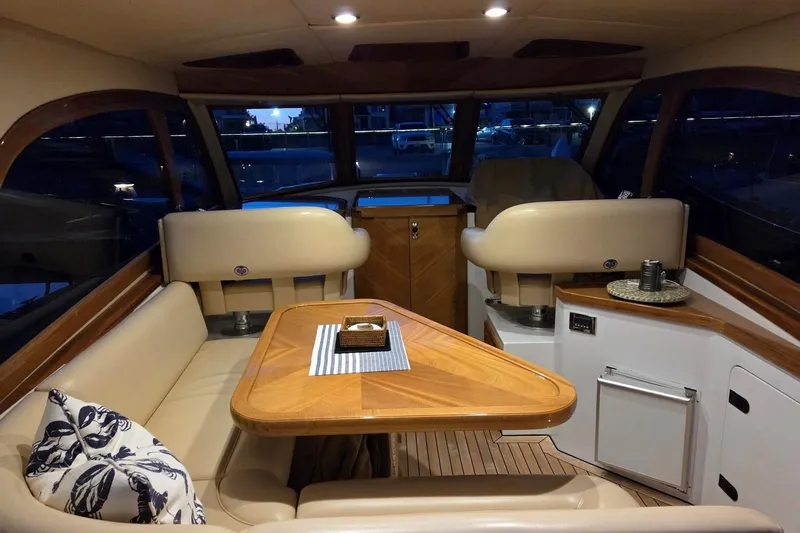 Mango Tango Yacht Photos Pics Luxurious interior of 2014 San Juan 41 yacht with elegant seating and wooden table.