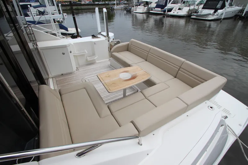  Yacht Photos Pics 2016 Sea Ray 510 Sundancer yacht with spacious outdoor seating and table, docked at marina.