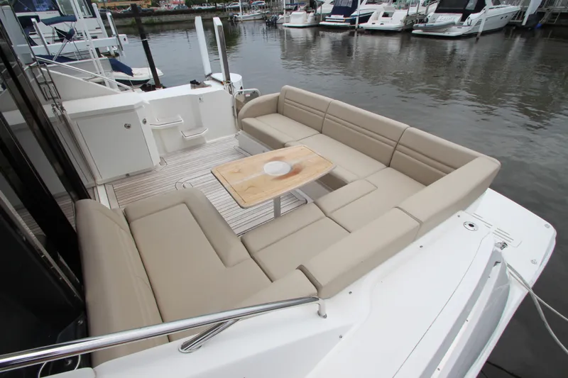  Yacht Photos Pics 2016 Sea Ray 510 Sundancer yacht with spacious outdoor seating area and table.