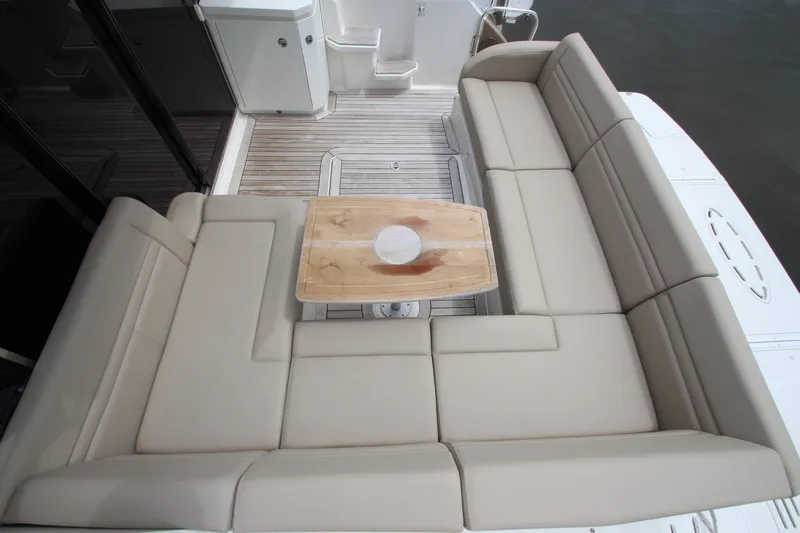  Yacht Photos Pics Luxurious seating area on 2016 Sea Ray 510 Sundancer yacht with wooden table.