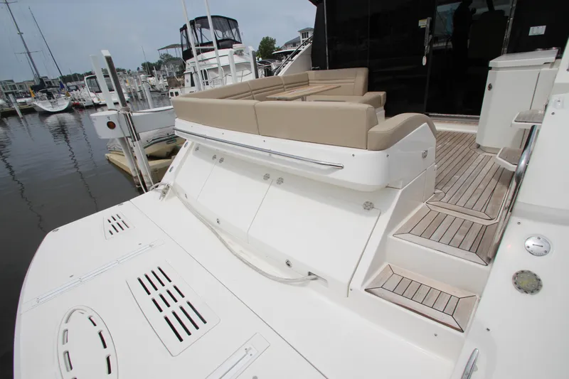  Yacht Photos Pics 2016 Sea Ray 510 Sundancer yacht with spacious deck and seating area in marina.