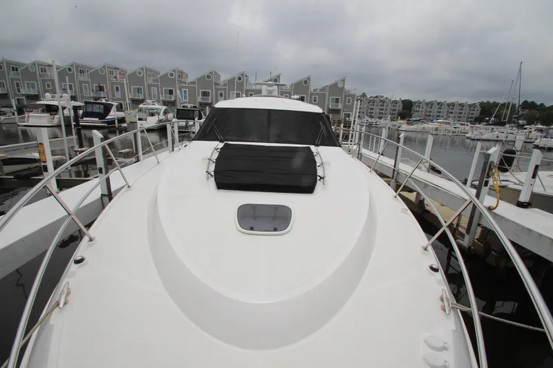  Yacht Photos Pics 2016 Sea Ray 510 Sundancer yacht docked at marina with overcast sky.